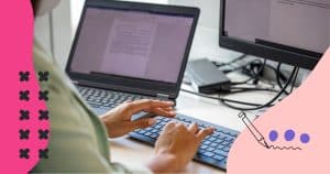 a man typing on his computer